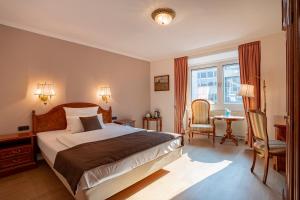 Cama ou camas em um quarto em Villa Westend Hotel an der Messe