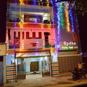 a building with lights on the front of it at Radha Party Hall in Kanchipuram