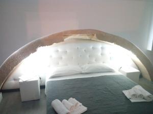 Postel nebo postele na pokoji v ubytování San Giorgio Modica Hotel