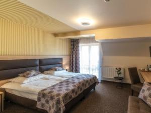 Posteľ alebo postele v izbe v ubytovaní Hotel Zakopane Wellness & SPA ex Korona Tatr