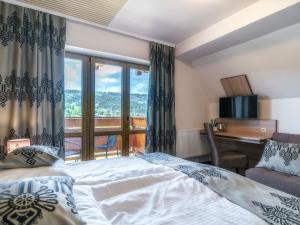 Posteľ alebo postele v izbe v ubytovaní Hotel Zakopane Wellness & SPA ex Korona Tatr