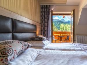 Posteľ alebo postele v izbe v ubytovaní Hotel Zakopane Wellness & SPA ex Korona Tatr
