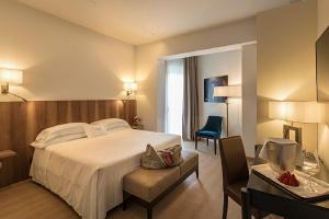 Letto o letti in una camera di Hotel Laurin