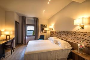 Letto o letti in una camera di Hotel Laurin