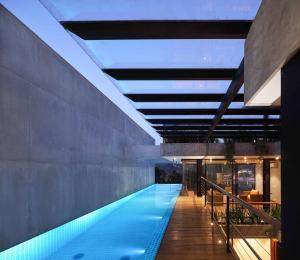 a swimming pool in the middle of a building at Lakewood Residence in Kandy