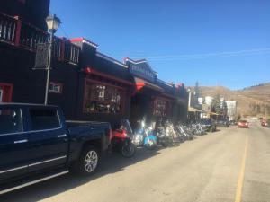 a truck parked in front of a row of motorcycles at The Cochrane Rockyview Hotel in Cochrane