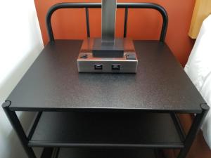 a black table with a machine on top of it at Best Lynnwood Inn in Lynnwood