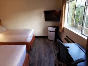 Postel nebo postele na pokoji v ubytování Best Lynnwood Inn