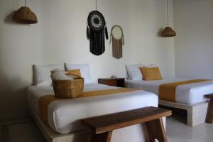 Postel nebo postele na pokoji v ubytování Tierra Mia Boutique Hotel