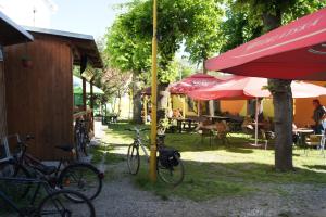 a group of bikes parked next to tables and umbrellas at Penzion Modrý Jelen in Vidnava