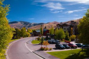 a street in a town with mountains in the background at Elkhorn Village in Sun Valley