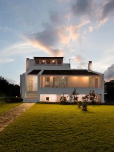 Holiday home next to orange tree orchard