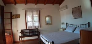 a bedroom with a large bed and a window at Villa Filiza in Sívas