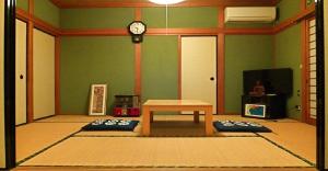 a room with a table and a clock on the wall at 8Bed Dormitory Room - Aoshima Guesthouse Hooju - Vacation STAY 6198 in Miyazaki