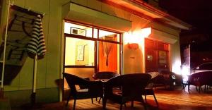 a restaurant with a table and chairs in a room at 8Bed Dormitory Room - Aoshima Guesthouse Hooju - Vacation STAY 6198 in Miyazaki