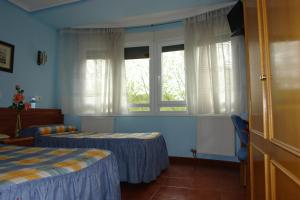 Posteľ alebo postele v izbe v ubytovaní Hostal Campus