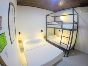 a bunk bed room with two bunk beds in it at Pousada da Milla in Presidente Figueiredo