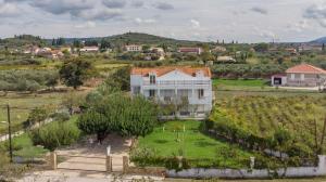 an aerial view of a house in a vineyard at Yiota Studios in Alykes