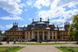 a large building with people walking in front of it at Ferienwohnung am Dresdner Elbhang in Dresden