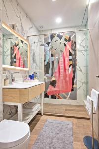 a bathroom with a toilet and a sink at FERHADIJA Apartments by Nejra in Sarajevo +17 photos