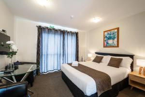 Postel nebo postele na pokoji v ubytování 123 Motel
