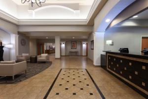 a lobby of a hotel with a waiting room at Wingate by Wyndham Moses Lake in Moses Lake
