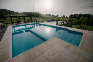 Bazén v ubytování Cabañas Valle de los Ciervos nebo v jeho okolí