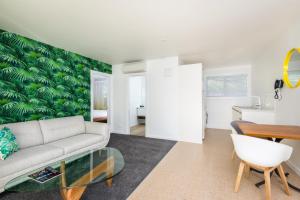 a living room with a couch and a table at The Adelphi in Christchurch