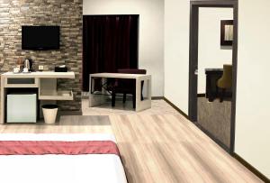 TV a/nebo společenská místnost v ubytování Hotel Sinar 1