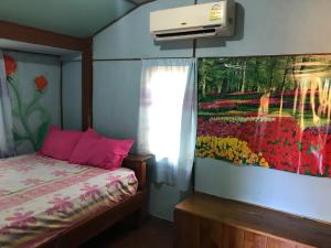 Voodi või voodid majutusasutuse Koh Mak Green View Resort toas