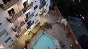 an overhead view of an apartment building with a swimming pool at JRMPT Residence in Cebu City