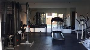 a gym with a bunch of equipment in a room at JRMPT Residence in Cebu City