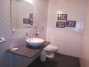 a bathroom with a sink and a toilet at La Casa de Melgar in Arequipa