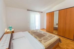 Postel nebo postele na pokoji v ubytování Apartments Matejka I