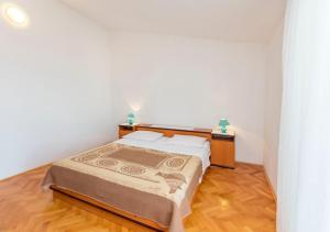 Postel nebo postele na pokoji v ubytování Apartments Matejka I