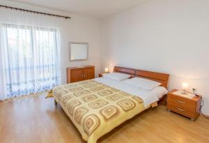 Postel nebo postele na pokoji v ubytování Apartments Matejka I