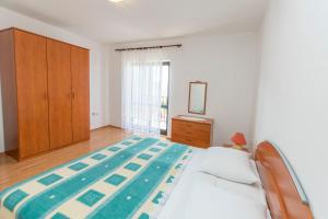 Postel nebo postele na pokoji v ubytování Apartments Matejka