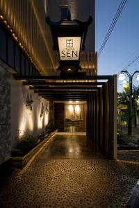 a hallway of a building with a sign on it at Hotel Sen (Adult Only) in Osaka