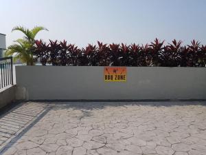 a wall with a new lane sign on it at HZ Homestay @Ascotte Boulevard in Semenyih