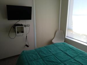 TV a/nebo společenská místnost v ubytování Departamento familiar en Viña del Mar