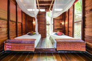 Ein Bett oder Betten in einem Zimmer der Unterkunft Castaway Resort Koh Lipe