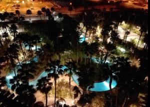 an overhead view of a pool at a resort at night at Suites at Tahiti Village Resort and Spa-No Resort Fee in Las Vegas