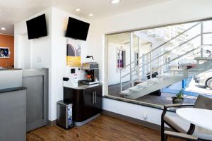 a living room with a staircase in a building at Motel 6-Odessa, TX - 2nd Street in Odessa