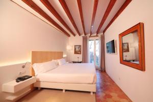 Postel nebo postele na pokoji v ubytování AH Art Hotel Palma