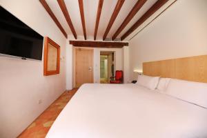 Postel nebo postele na pokoji v ubytování AH Art Hotel Palma