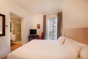 Postel nebo postele na pokoji v ubytování AH Art Hotel Palma