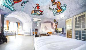 Giường trong phòng chung tại Kenting Ha-Bi Star Fort
