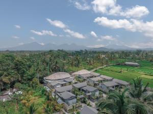 an aerial view of a resort with mountains in the background at Daun Lebar Villas in Payangan