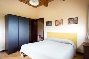 Postel nebo postele na pokoji v ubytování Agriturismo Il Poderaccio