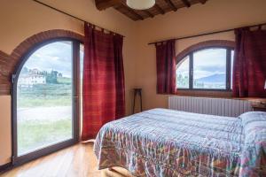 Postel nebo postele na pokoji v ubytování Agriturismo Il Poderaccio + 37 fotografií
